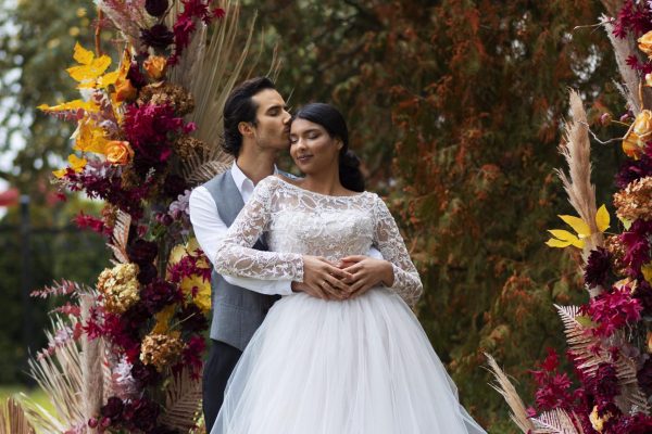 front-view-couple-posing-wedding-min